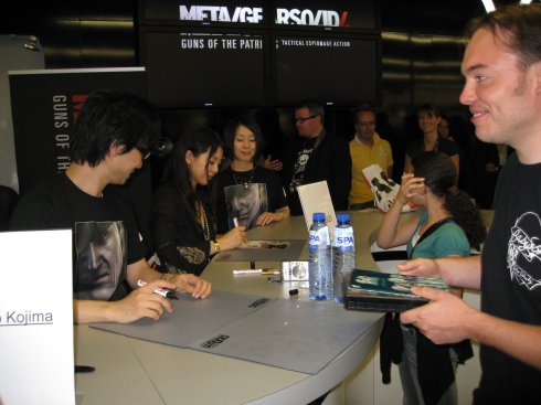 Anne de Raad getting an autograph from Hideo Kojima on his SD Snatcher